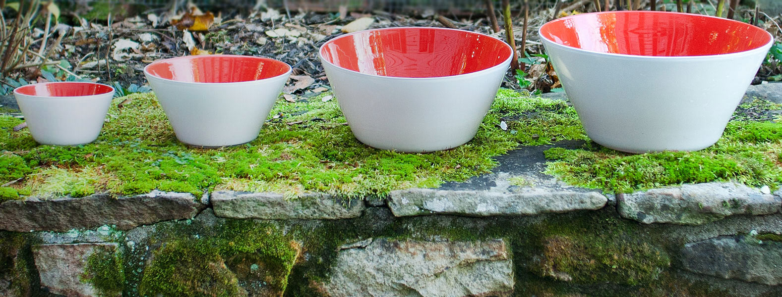 https://servekindness.com/cdn/shop/files/Red-Bowls-Lined-Up-on-Moss-Facebook-Banner_30b8a906-7738-4f0a-a542-ed7b14ee4c56_2048x.jpg?v=1673643420