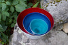 Ruby, Aquamarine and Teal handblown glass bowls nested from Serve Kindness