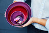 Nested set of handblown glass bowls from Serve Kindness in Amethyst, Ruby and Amethyst colors